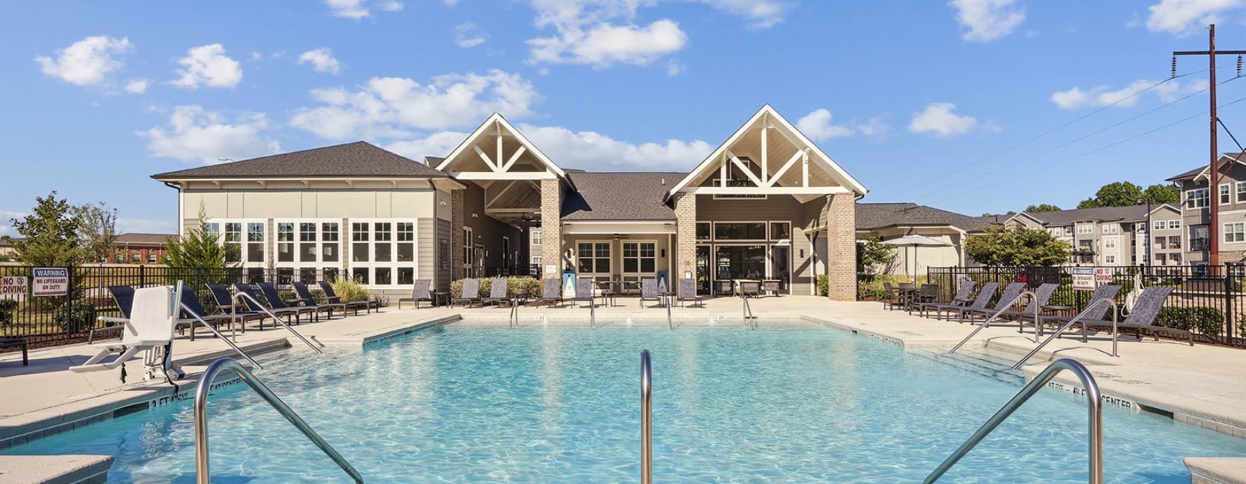 pool with a building behind it 