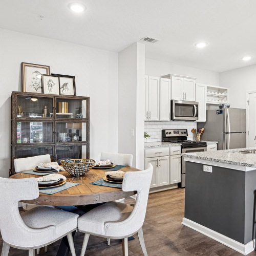 Gorgeous living areas to entertain and enjoy dining room table with view of a kitchen