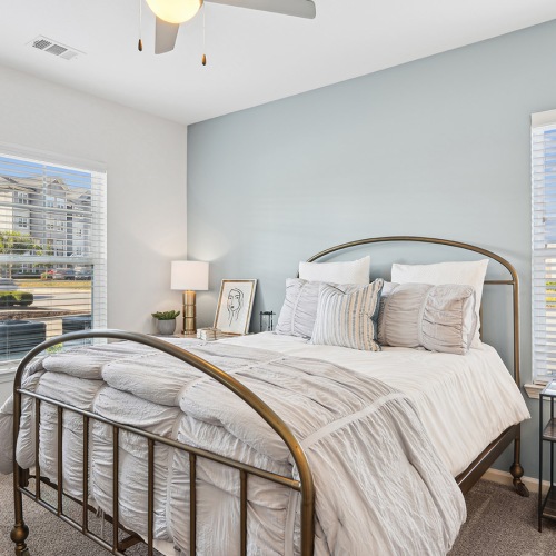 Beautiful bedrooms to fit every need bedroom with bed and wall art