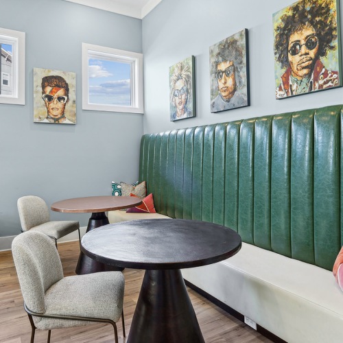 Everything within reach seating area with art on the wall
